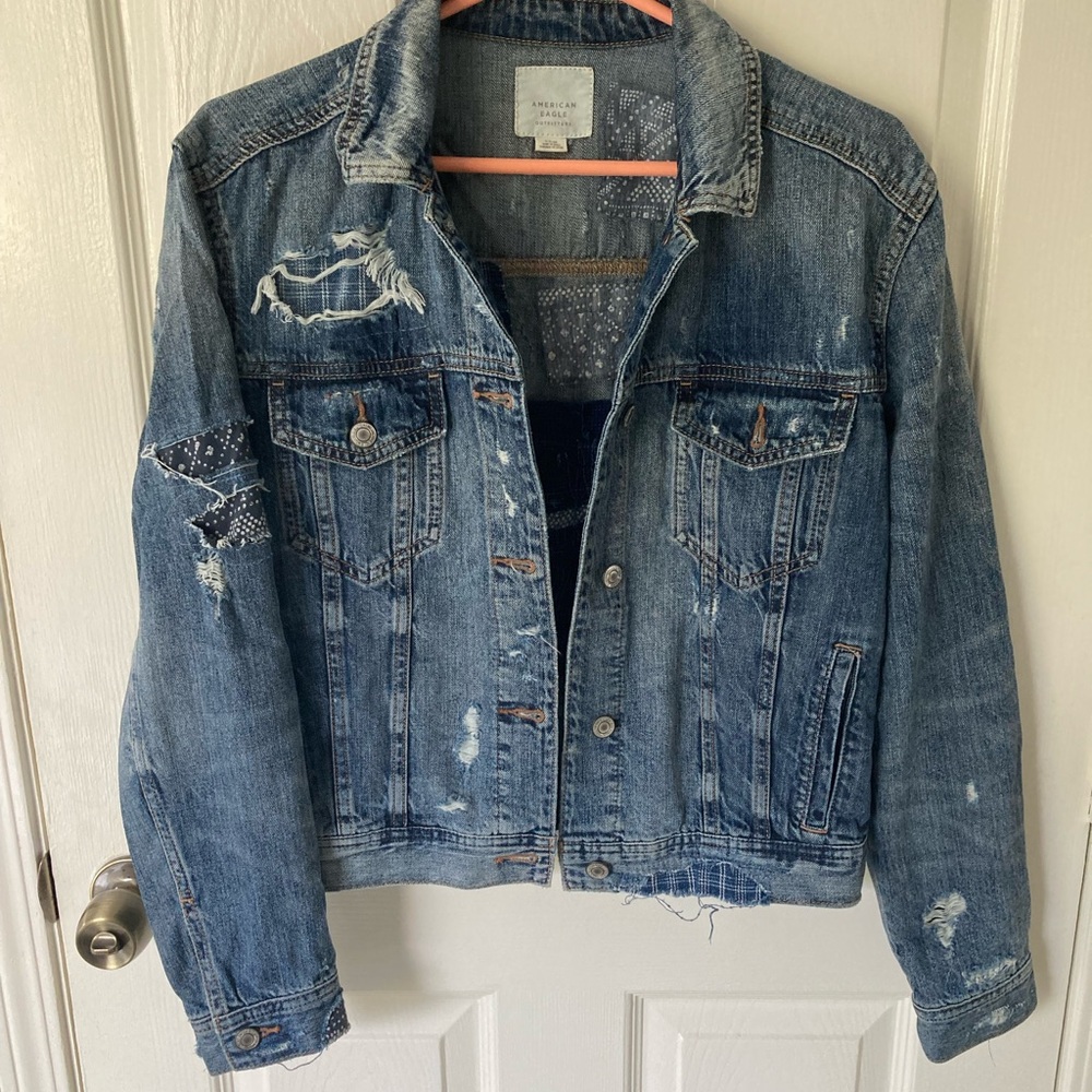 American Eagle Distressed blue jean jacket w/patchwork Size~S.  NWOT